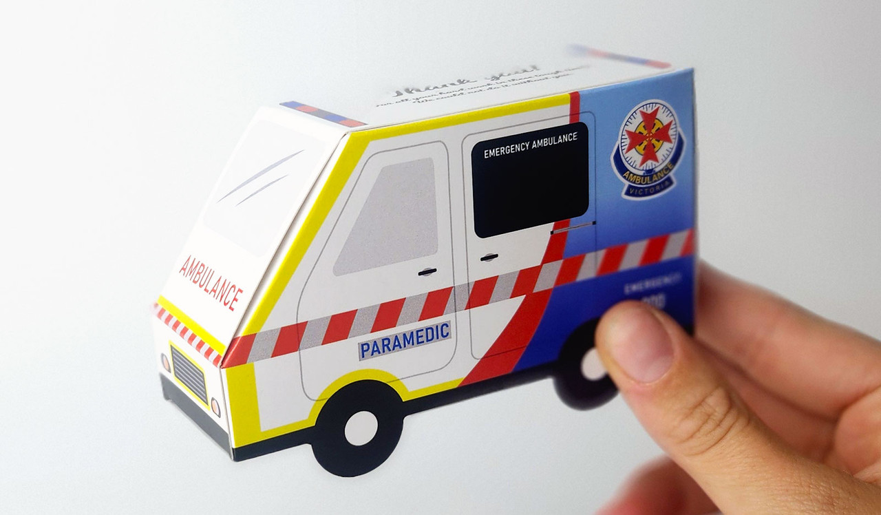 Model holding Branded Ambulance Van Box for sizing purposes