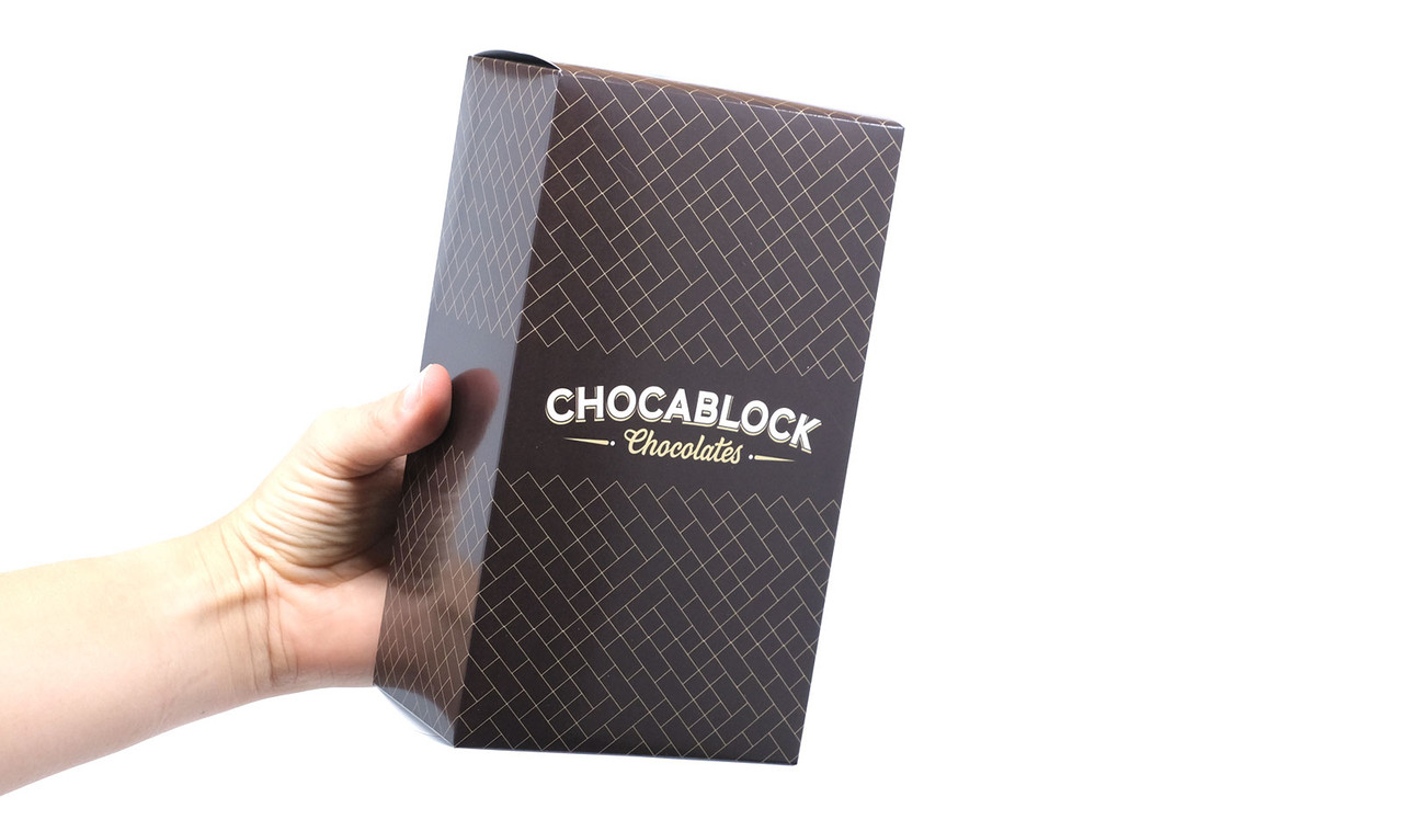 Model holding gift box for sizing purposes.