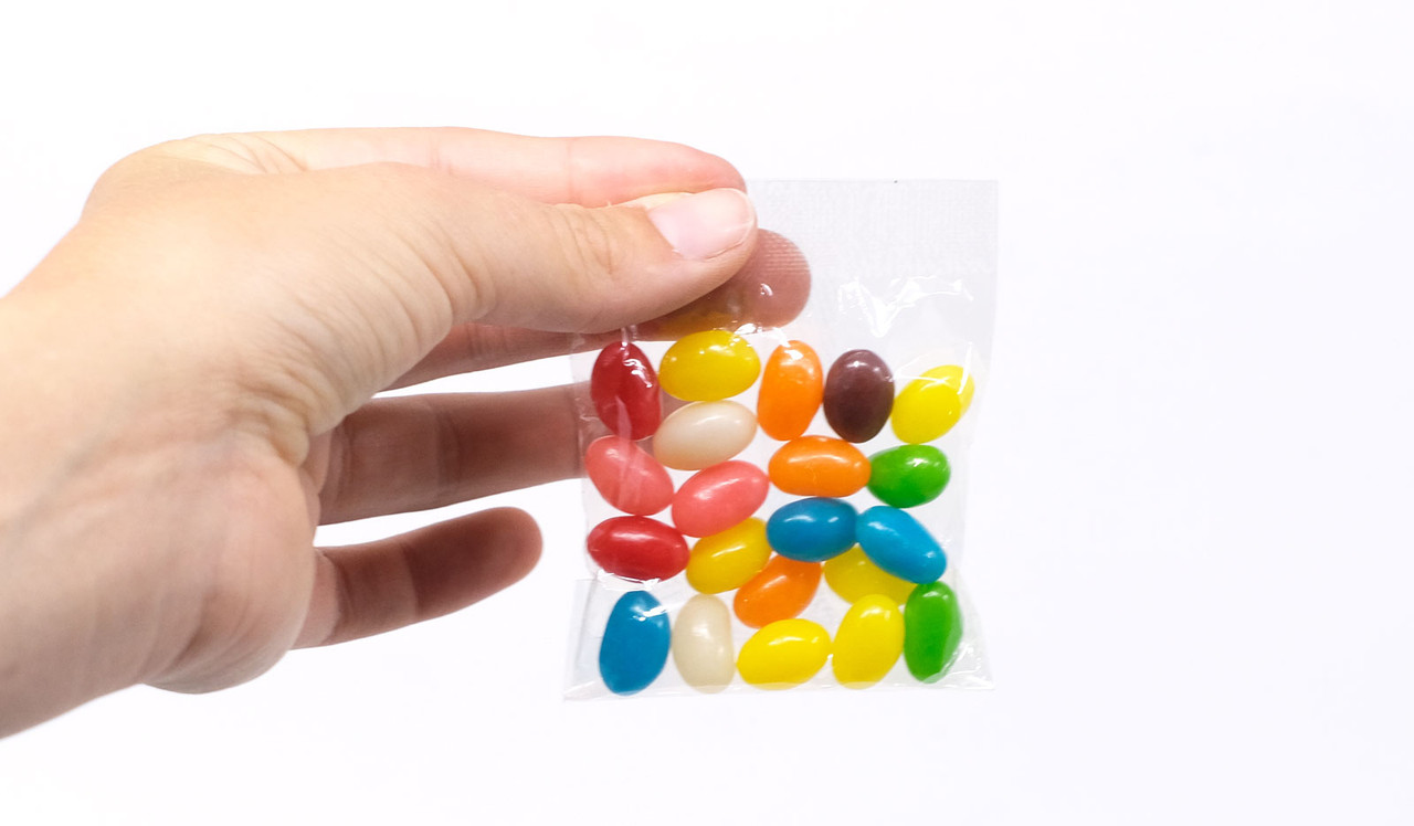 Model holding 25g branded jelly bean bag