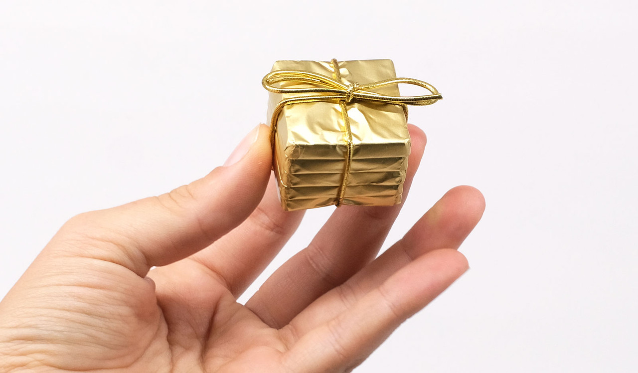 Model holding Branded Mini Chocolate Stack
