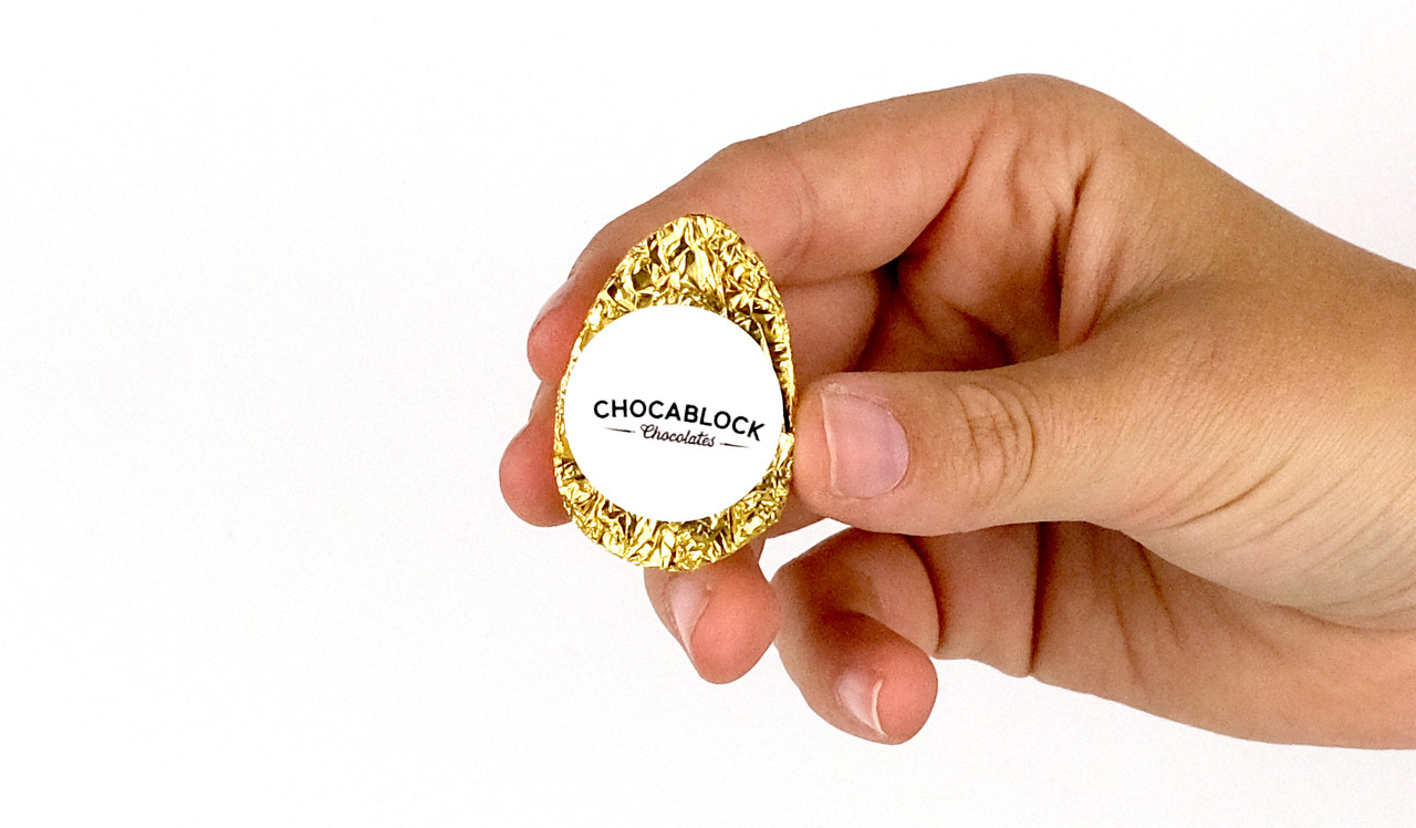 Model holding half egg for sizing purposes