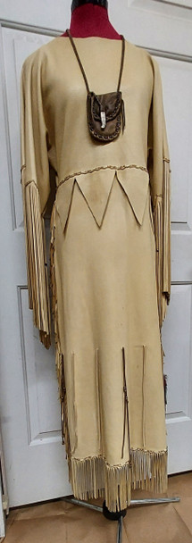 Handcrafted West Plains buckskin Indian dress with fringe, beads, porcupine quills, and medicine bag featuring eagle-carved horn closure Handcrafted West Plains buckskin Indian dress with fringe, beads, porcupine quills, and medicine bag featuring eagle-carved horn closure