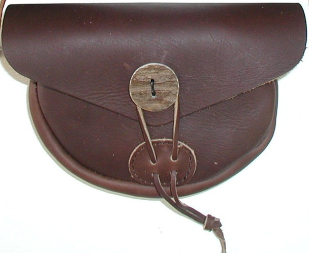 Courier Belt Bag in brown leather with bone button closure, tapered gusset, and minimalist design by October Country Courier Belt Bag in brown leather with bone button closure, tapered gusset, and minimalist design by October Country