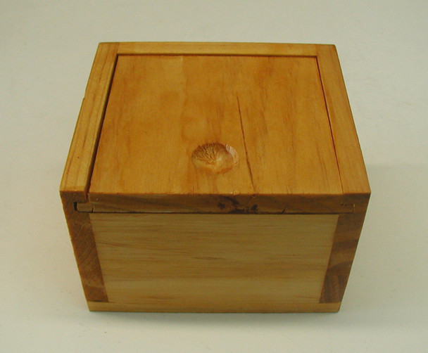Small wooden storage box measuring 4.25" x 3.75" x 3", perfect for organizing small items or keeping essentials within reach.