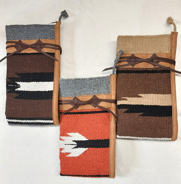 Horse blanket rifle cover lined with heavy canvas, available in assorted colors and sizes, with optional front pocket and leather trim.
