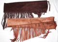 Oil-tanned suede rifle cover with narrow fringe, designed for black powder cartridge rifles; includes tie-down strap and toe strap for easy removal.