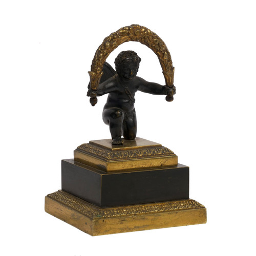 Empire Gilt and Patinated Bronze Paperweight of a Cherub