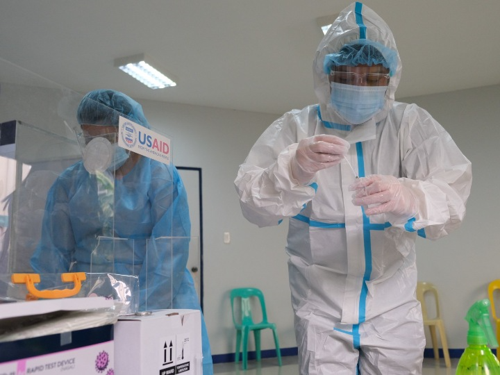 COVID testing procedures taking place in the Philippines by USAID US Agency for International Development via Flikr.