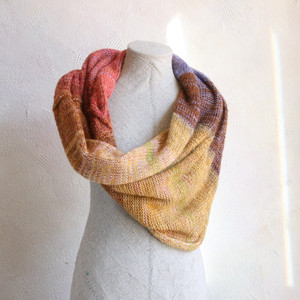 Mosaic Sun shawl wrap on dress form knit by Inese for Wrapture by Inese in gold pink lavender rose brown