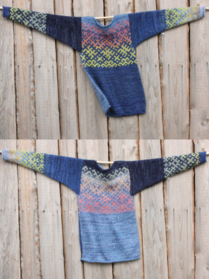 view of both sides of reversible unisex Sapphire Latvian symbols sweater size M on woodshed wall, knit by Wrapture by Inese