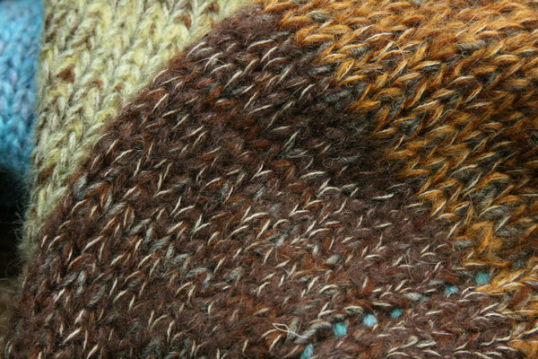 Wild Rose Hips Liene sweater coat wool, mohair, cotton and silk blend. knitting detail closeup of Ineses unique way of blending colors in her knits.