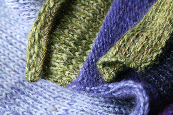 Pansies Liene Sweater Coat knitting detail closeup of Ineses unique way of blending colors in her knits. green pocket and collar, Wrapture by Inese