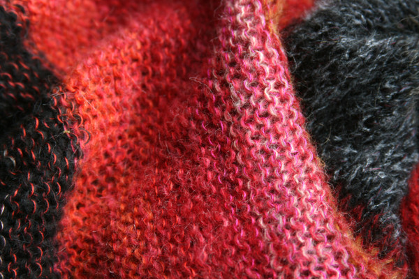 Loop scarf knit by Inese Iris Liepina inspired by the colors of Rakvag, Norway warf warehouses. Photographed closeup of color blended knitting by Wrapture by Inese