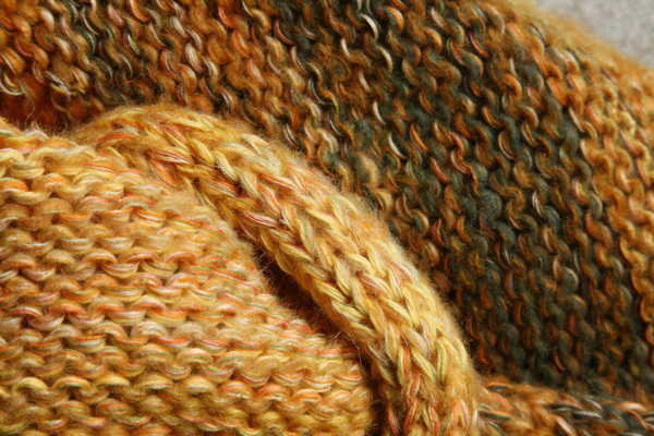 detail of knitting of Ancient Woods shawl wrap knit with gold sage green and beige yarns by Inese of Wrapture by Inese