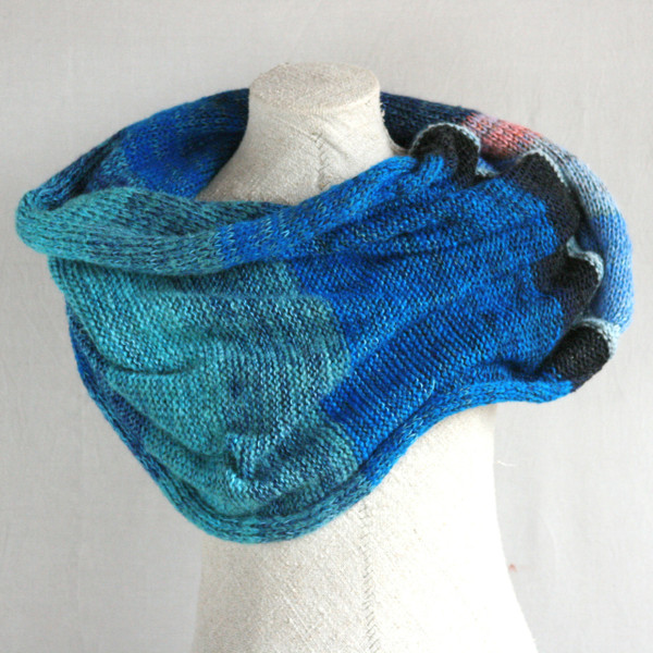 Catalonian Sea shawl wrap on dress form knit by Inese for Wrapture by Inese in blue teal pink
