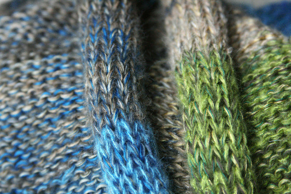 New Zealand shawl wrap detail of knitting in blue teal green beige