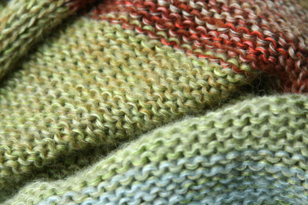 Willow shawl wrap detail of knitting in sage green celadon gold rust