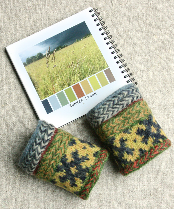 Knit and Felted wrist warmers with color card of Summer storm with twisted stitches inspiration that were knit at the DIY knitting  taught by Wrapture by Inese