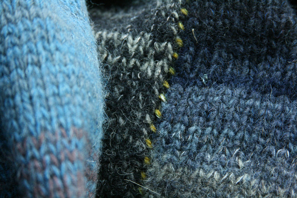 contrast color seam stitching detail in closeup of knitting color blend in Mongolian Lake felted statement coat knit for Wrapture by Inese
