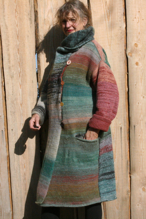 Inspired by the colors of Birch in an XL felted wool coat with a shawl collar that can be worn in multiple ways. Knit with local Baltic raised wool, cotton, silk. Machine washed and felted. 
Wrapture by Inese