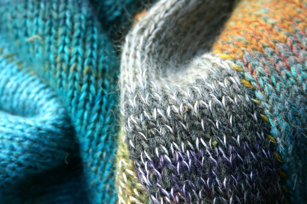closeup of knitting detail with contrast stitched seam in Greenstone calf length tank dress knit by Inese Iris Liepina