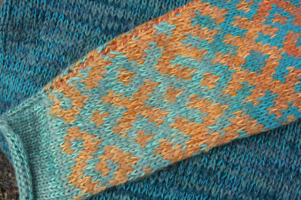 Turquoise blue Latvian symbols sweater size L detail of pattern knitting 