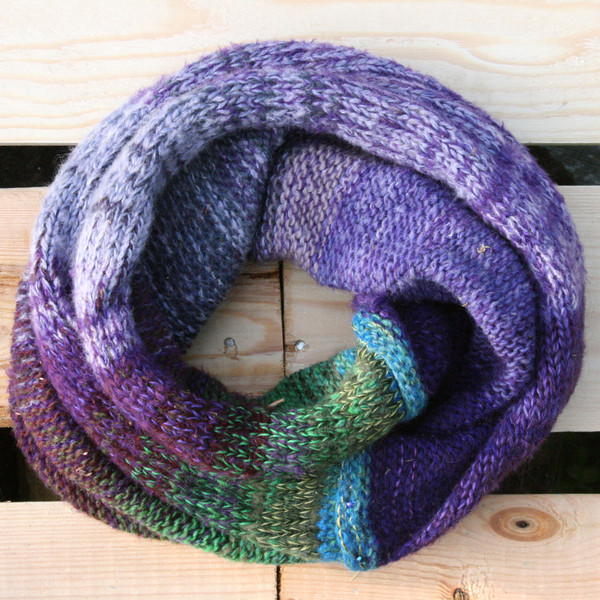Pansies color way snood cowl flat on wood pallet background, knit by Inese Iris Liepina for Wrapture by Inese.