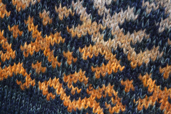 knitting fair isle Latvian symbols pattern closeup in Denim Sunset XL reversible sweater