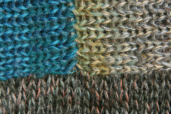 detail in closeup of unique ombre knitting with in scalloped hem sweater dress knit by Wrapture by Inese inspired by the edge of a Fjord in Norway color story