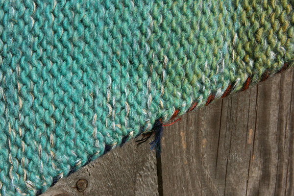 detail in closeup of unique ombre knitting with in scalloped hem sweater dress knit by Wrapture by Inese inspired by the edge of a Fjord in Norway color story