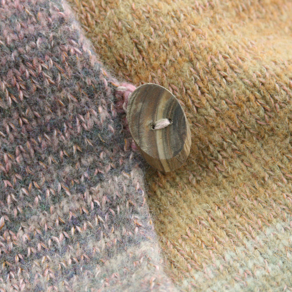 detail of button of Meadow Grass colors inspired boiled wool hoodie jacket by Wrapture by Inese