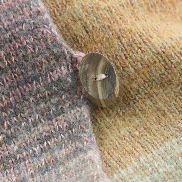 detail of button of Meadow Grass colors inspired boiled wool hoodie jacket by Wrapture by Inese