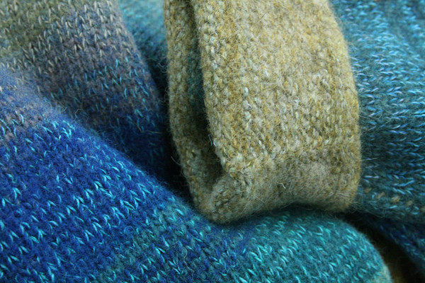 detail of folded cuff of Mongolian Trek colors inspired boiled wool hoodie jacket by Wrapture by Inese