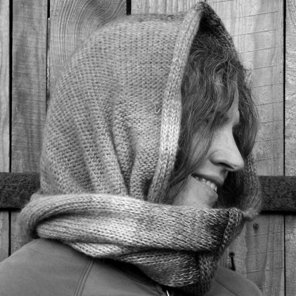 Black and white photo of Wrapture by Inese cowl worn to cover your head.