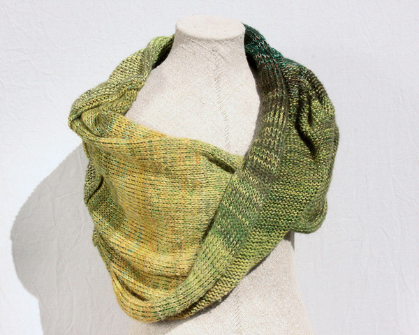 Forest Land shawl wrap on dress form knit by Inese for Wrapture by Inese in green olive lime grass