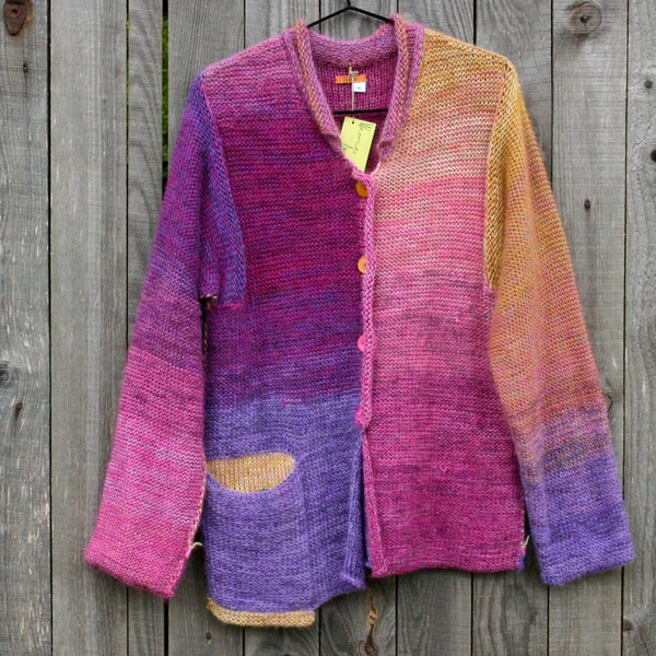 Aurora with purl side showing cardigan with mismatched buttons
