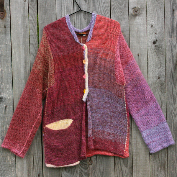 Bitene purl side showing funky pocket miss matched button cardigan