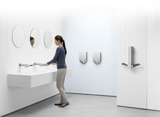 dyson-hand-dryers-woman-using.jpg