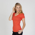 Model wearing a fitted coral marl v-neck tee with short sleeves and a clean front panel