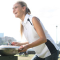 White sleeveless polo shirt with navy contrast side panels and collar detail