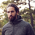 Charcoal marle heavy knit fleece jacket with hood and full-length zip worn by bearded man outdoors