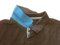 Dark brown pique polo shirt with teal contrast collar and striped placket trim, close-up detail shot