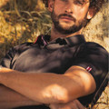 Black pique polo shirt with red and white contrast tipping on collar and sleeve cuffs