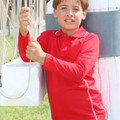 Child wearing red long sleeve polo shirt with white contrast piping on collar and side seams