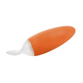 Orange silicone baby food dispensing spoon with white translucent tip, elongated oval body, flat lay on white background