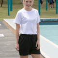 Black mesh athletic shorts with elastic waistband paired with white crew neck tee, front view showing relaxed fit and mid-thigh length