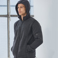 Charcoal heather fleece jacket with detachable hood and sleeve zip pocket worn by man