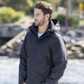 Navy blue waterproof jacket with detachable hood and sleeve pocket, worn over white tee