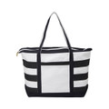 Canvas tote bag with black and white horizontal stripes, solid white front panel, and black handles
