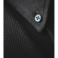 Close-up of black cotton jacquard knit polo collar with engraved four-hole button detail